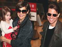 Tom Cruise and Katie Holmes with their daughter Suri Tom Cruise and Katie Holmes with their daughter Suri